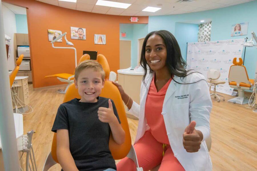 African american female orthodontist with a young child