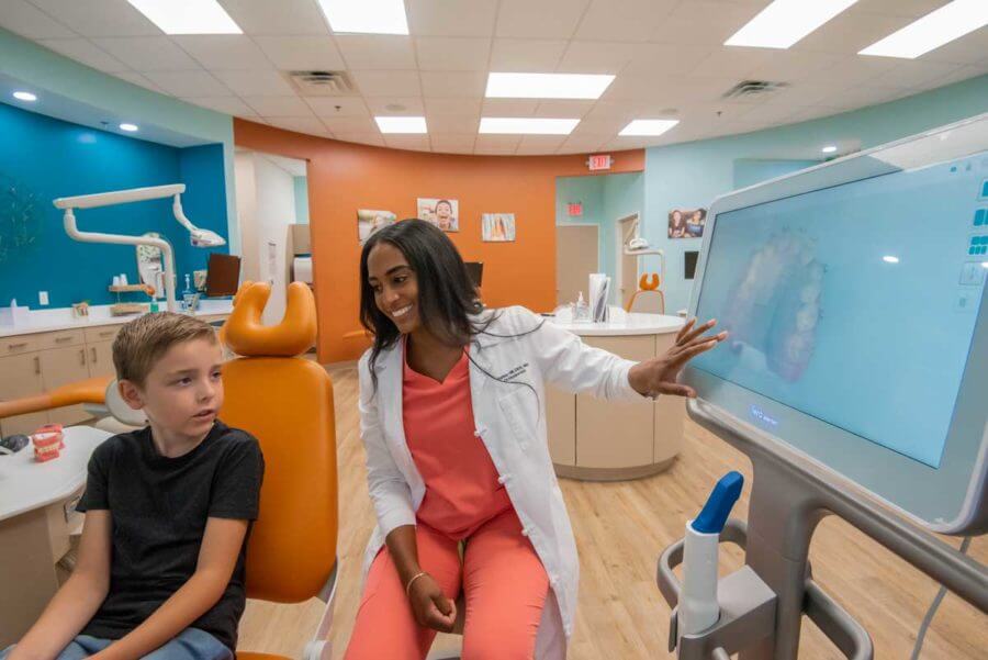 African american female orthodontist with a child